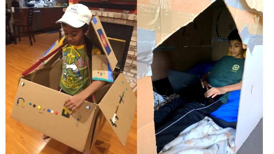 Veer as a kid wearing a cardboard robot costume